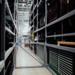 A detailed look at the interior of an industrial storage warehouse with metal shelves.